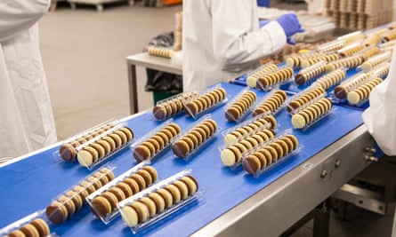 Chocolate macarons are packaged by Hotel Chocolat workers at the plant.