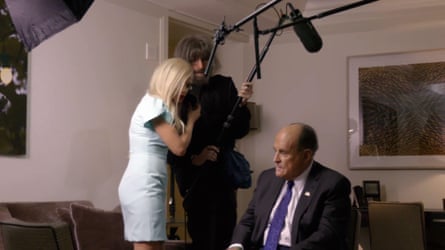 Sacha Baron Cohen and Maria Bakalova with Rudy Giuliani in Borat Subsequent Moviefilm