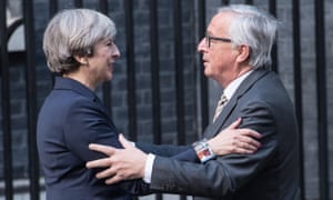 Theresa May greets Jean-Claude Juncker at 10 Downing Street.