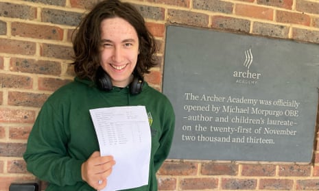 GCSE results day 2023: higher fall in proportion of top grades in England than in other UK nations – as it happened | GCSEs 3 Image of Thomas Yiannikkou smiling holding up his GCSE results