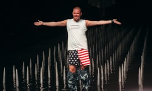 Alexander McQueen drops his trousers at the finale of his spring 2000 collection show in New York.