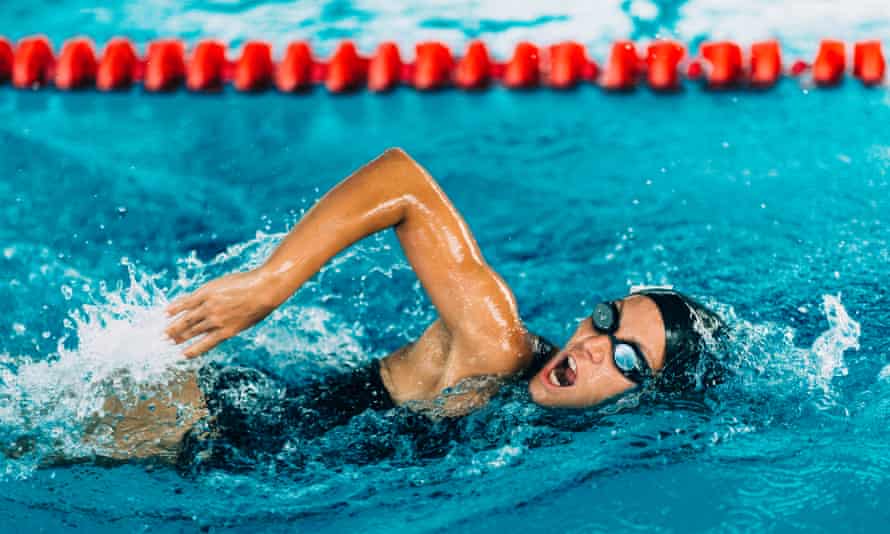 Female freestyle swimming competitor in action