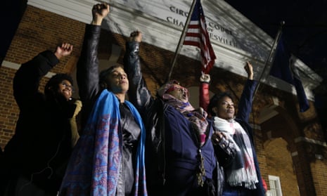 Local activists raise their fists outside Charlottesville general district court after a guilty verdict was reached in the trial of James Fields in Charlottesville, Virginia, on 7 December. 