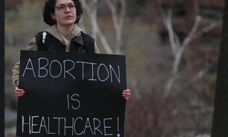 An activist holds a Pro-Choice poster