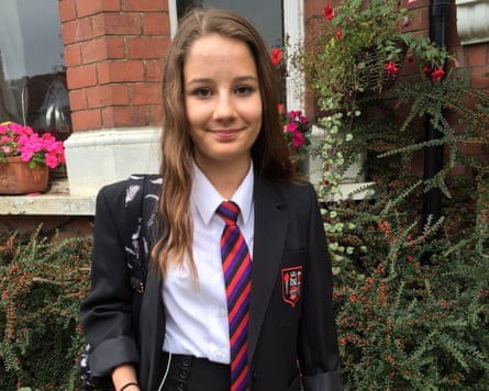 Molly Russell outside her house smiling in her school uniform