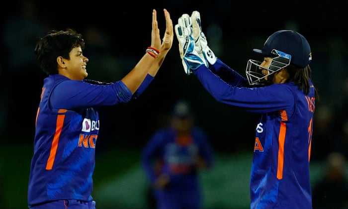 India's Shafali Verma (left) celebrates with Yastika Bhatia after taking the wicket of England's Kate Cross.