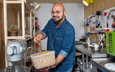 ehab sayed with a tub of dried orange peel in his container in shepherds bush west london