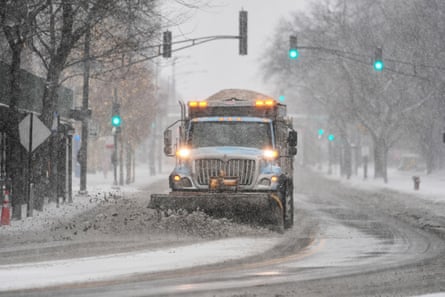 plow pushes snow on road