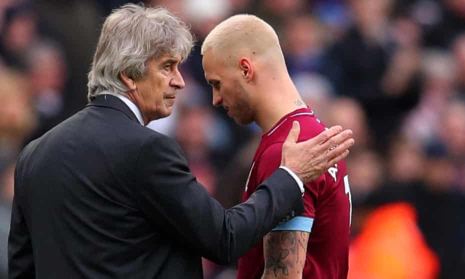 Marko Arnautovic walks past Manuel Pellegrini after coming off during last week’s win over Arsenal.