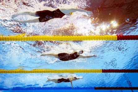 Australia’s Lani Pallister, top, Katie Ledecky of the US, center, and Canada’s Summer Mcintosh, bottom, compete in the women’s 800m freestyle on Saturday in Singapore.