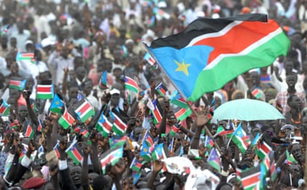 Thousands of Southern Sudanese wave the flag of their new country, 9 July 2011