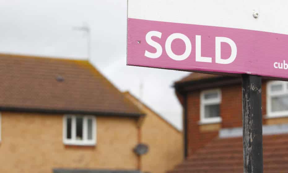 Estate agent's 'sold' sign outside a property