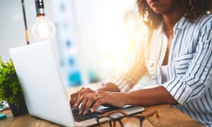 Woman typing on laptop