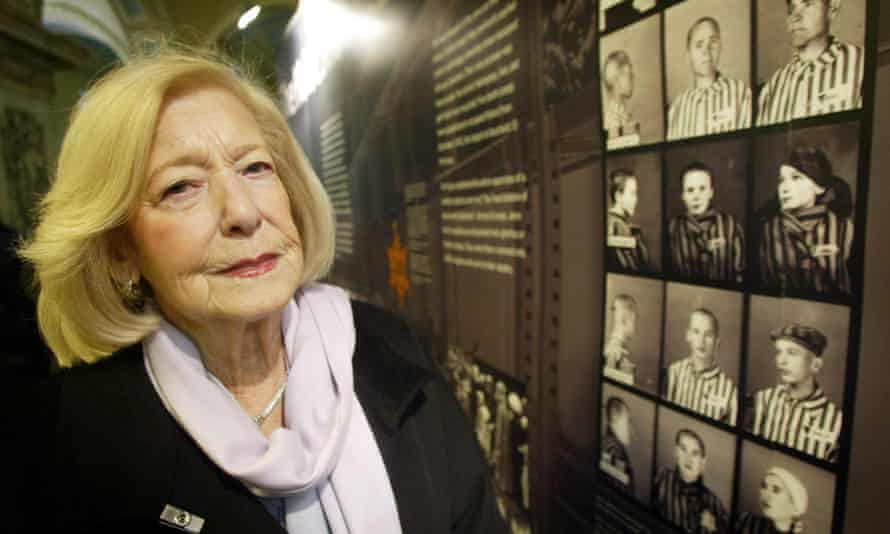 Gena Turgel examines a Holocaust memorial board at Belfast City Hall