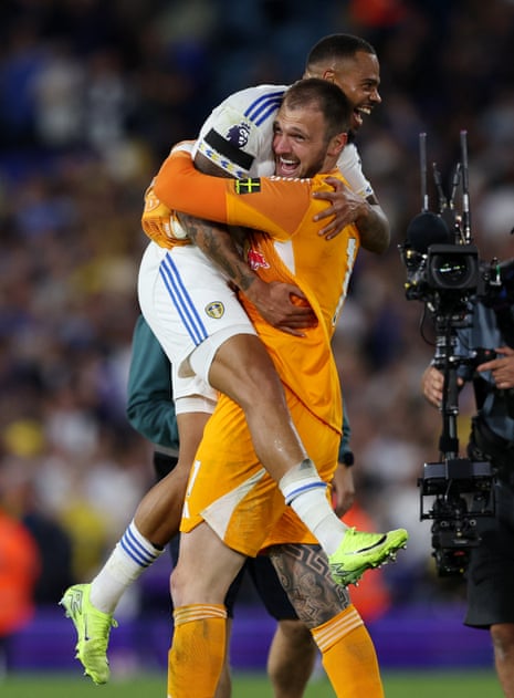 Leeds United's goalscorer Lukas Nmecha and goalkeeper Lucas Perri celebrate after their victory over Everton.