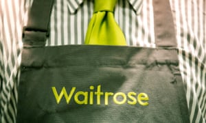 Waitrose branding on a staff member’s uniform