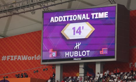 A screen at Khalifa International Stadium displays the 14 minutes of stoppage time played in the first half between England and Iran.