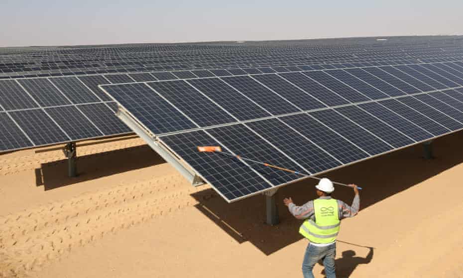 A man cleans the photovoltaic solar panels at the Benban Solar Park, the world’s largest solar power plant, in Aswan, Egypt