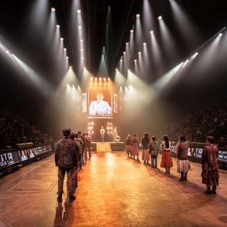 John Malkovich (centre, screen) as President Snow.