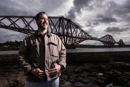 Ryan Forber stands in front of the Forth rail bridge in Fife. Ryan Forber stands in front of the Forth rail bridge in Fife.