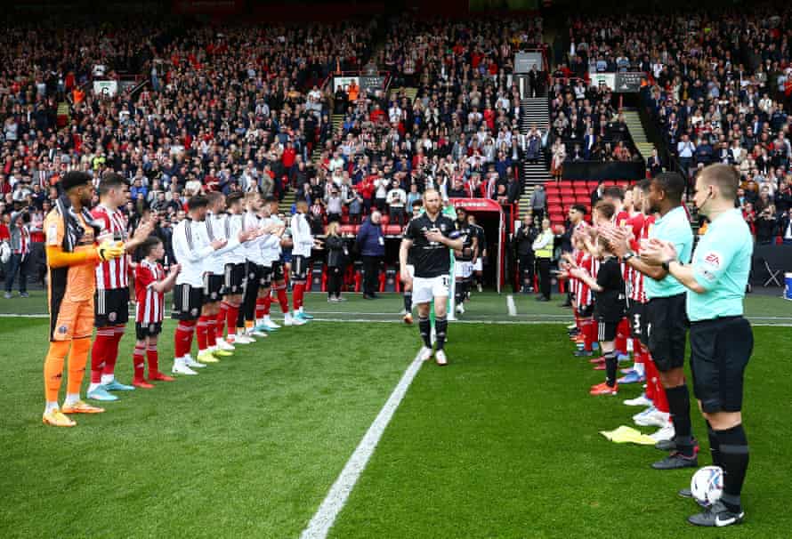Sheffield United players form a guard of honour for Fulham ahead of the match at Bramall Lane.