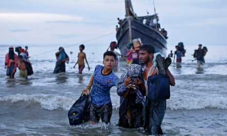 Ethnic Rohingya disembark from their boat upon landing in north Aceh, Indonesia. 