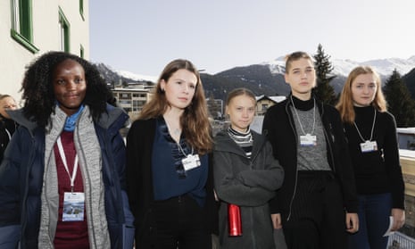 Vanessa Nakate, Luisa Neubauer, Greta Thunberg, Isabelle Axelsson and Loukina Tille, from left, arrive for a news conference in Davos, Switzerland, on Friday 24 January. Nakate was cropped out of versions of the photo.