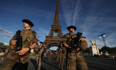 French soldiers patrol near to the Eiffel Tower