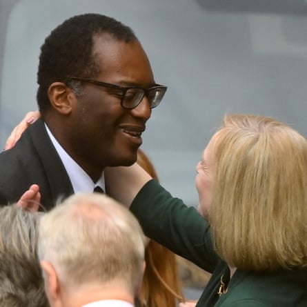 Liz Truss greets Kwasi Kwarteng with an embrace in July 2022