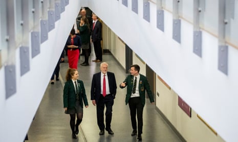 Jeremy Corbyn (centre) with head girl Lucy Symington and head boy Michael Hare during a visit today to Lagan College, Northern Ireland’s first integrated school.