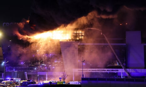 The Crocus City Hall alight after the attack.