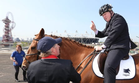 Boris Johnson with Olympic gold medalist Nick Skelton in front of the Olympic stadium and ArcelorMittal Orbit tower.