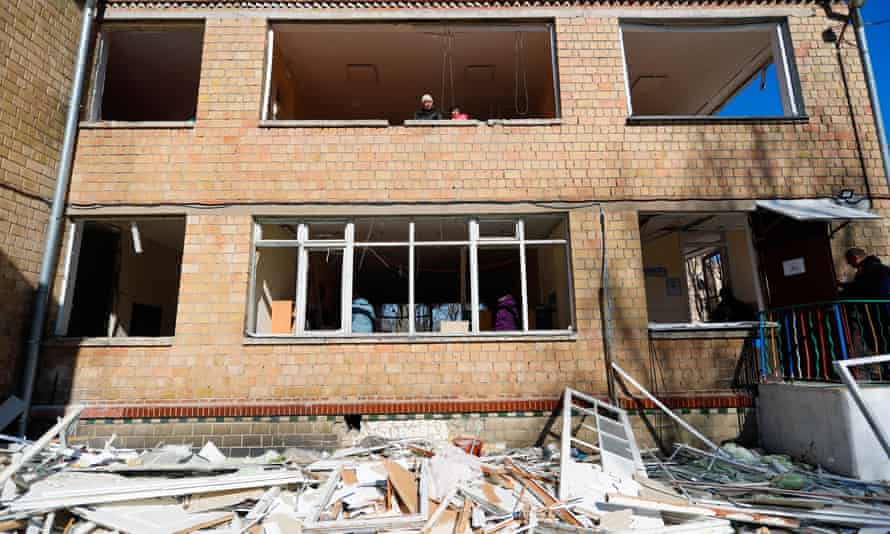 Wreckage and broken windows outside a damaged kindergarten in Vynohradar, Kyiv.