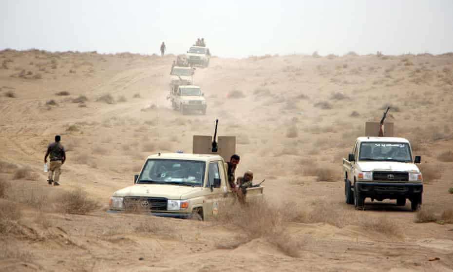 Yemeni government forces and vehicles take part in military operations on Houthi positions in the port province of Hodeidah, earlier this month
