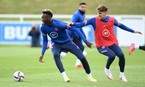 Tammy Abraham gets away from John Stones during England training at St George’s Park.