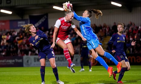 Ajax’s Lize Kop catches the ball above the head of and Arsenal's Stina Blackstenius during the 2-2 draw in the first leg of the Women’s Champions League qualifier.