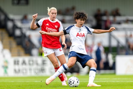 Toko Koga of Tottenham Hotspur makes a pass as Arsenal’s Alessia Russo looks on during their pre-season friendly.