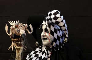 A man in jesters costume poses for a portrait