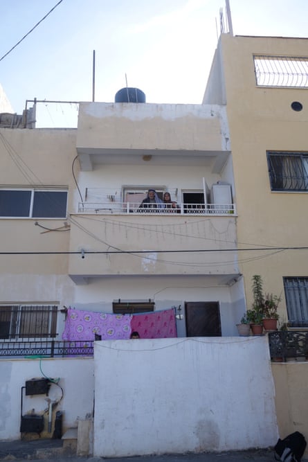 Ibrahim Mahmoud Saleh, on the balcony of his new apartment