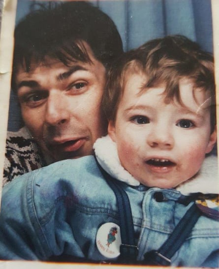 Jonathan Evans poses for a picture with his young son, Jason