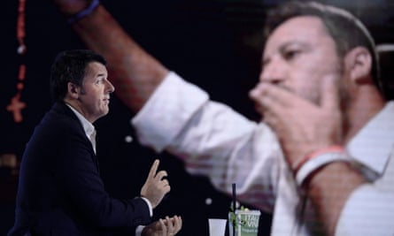 Matteo Renzi in front of a screen with the image of Matteo Salvini