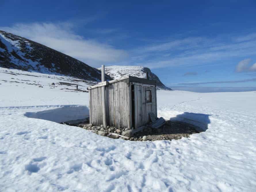 ‘Solitary specks in the vast landscapes’: a cabin on Svalbard.