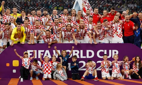 Croatia players, coaching staff and family members celebrate with their medals on stage as they finish in third place at the Qatar 2022 World Cup.