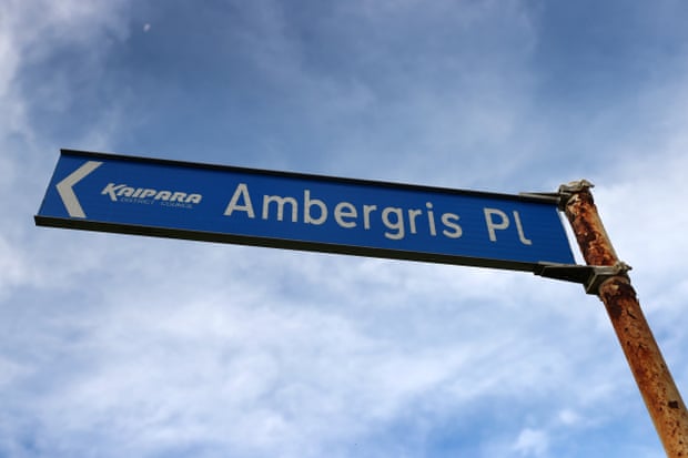 Rusty street sign reading Ambergris Place