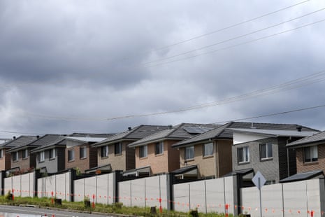 row of houses under grey cloudy sky
