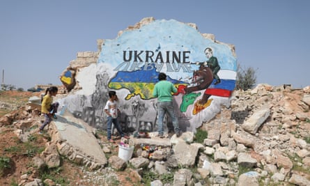 Graffiti showing solidarity with Ukraine on the ruins of a building in Idlib, Syria