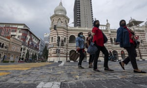 People walking near Independence Square in Kuala Lumpur yesterday.