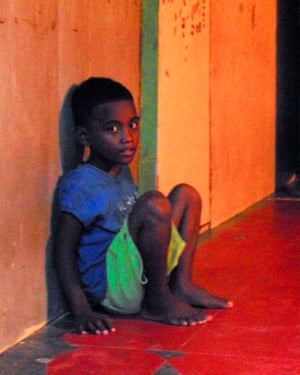 Eight-year-old Richard Lejka waits for his grandmother to come home.