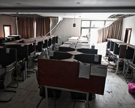 Abandoned work booth. The floor is dirty, the curtains are falling off the window.