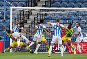 Huddersfield Town’s Chris Willock finishes smartly to give his team an early lead.